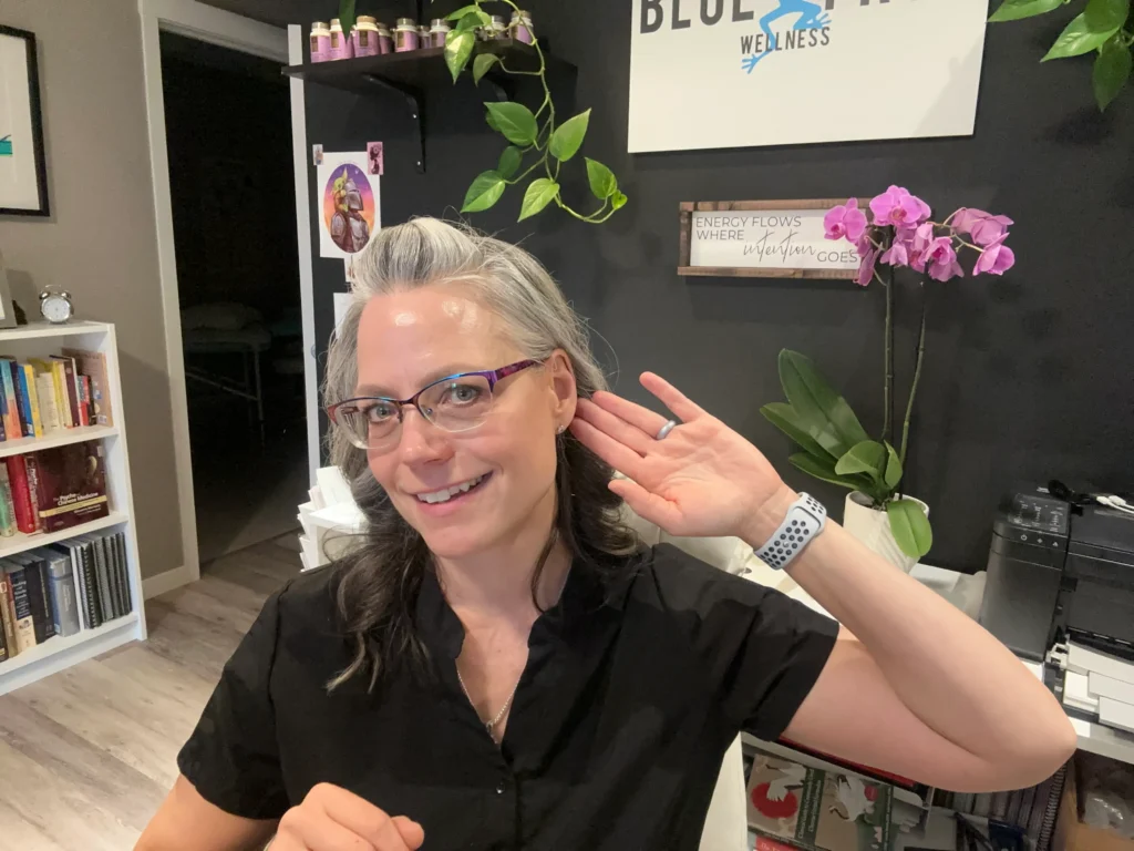 Vanessa Ebertz showing ear seeds as part of auricular acupuncture